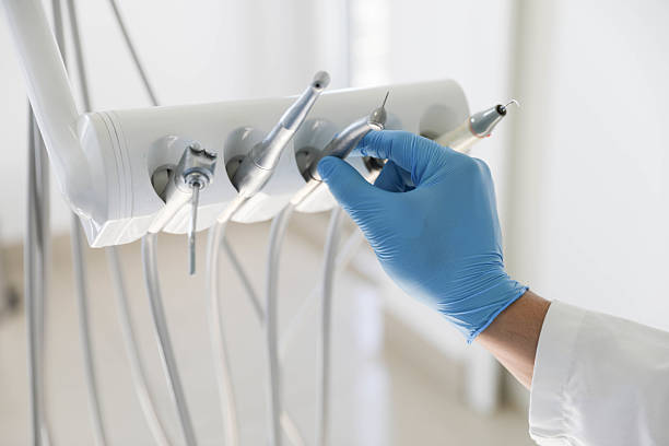 Professional Tooth Extraction technician working in Lanier County County, GA